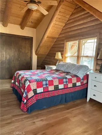a bedroom with a bed and a dresser