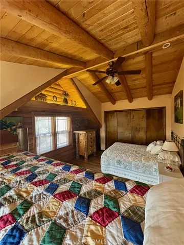 a view of a house with a large tree