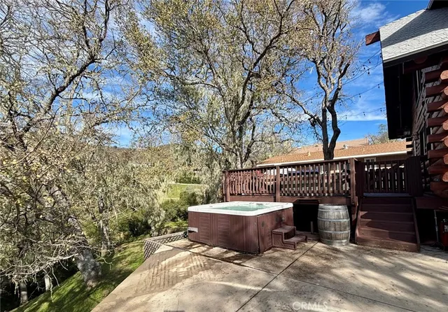 a view of patio with wooden fence