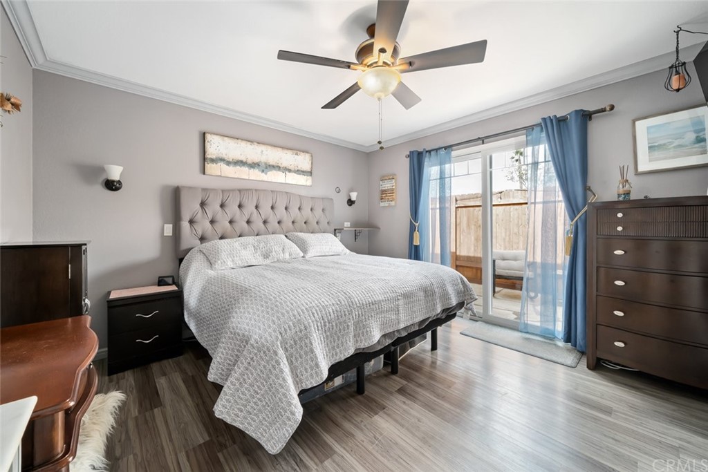 765 Lilac Drive Los Osos, CA 93402 - Photo 19 of 54 a bedroom with a bed and a tv on the dresser