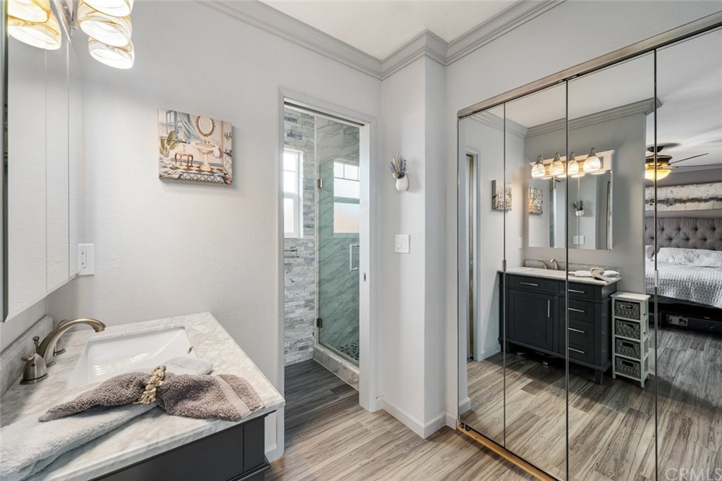 765 Lilac Drive Los Osos, CA 93402 - Photo 22 of 54 a bathroom with a tub sink and mirror