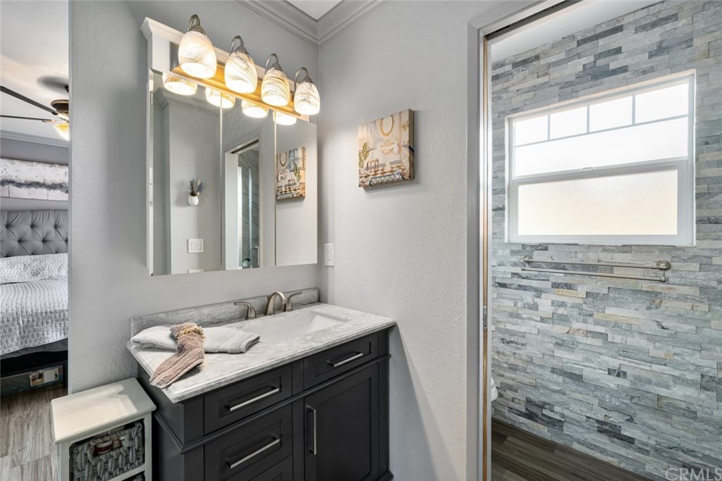 765 Lilac Drive Los Osos, CA 93402 - Photo 23 of 54 a bathroom with a sink a vanity and a mirror