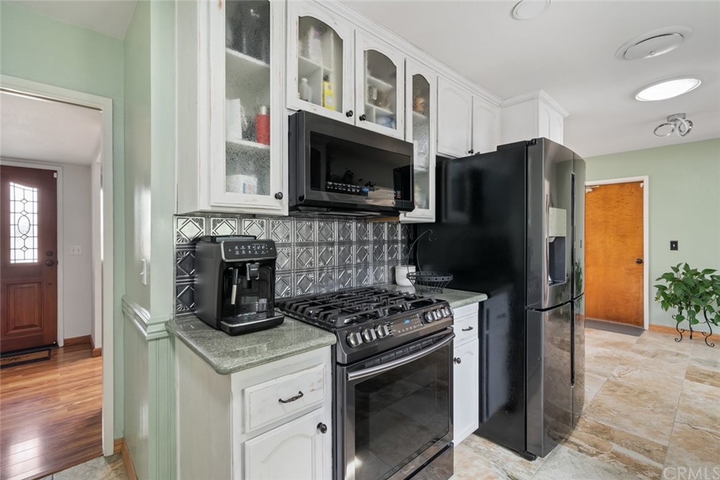 765 Lilac Drive Los Osos, CA 93402 - Photo 10 of 54 a kitchen with a stove and a refrigerator
