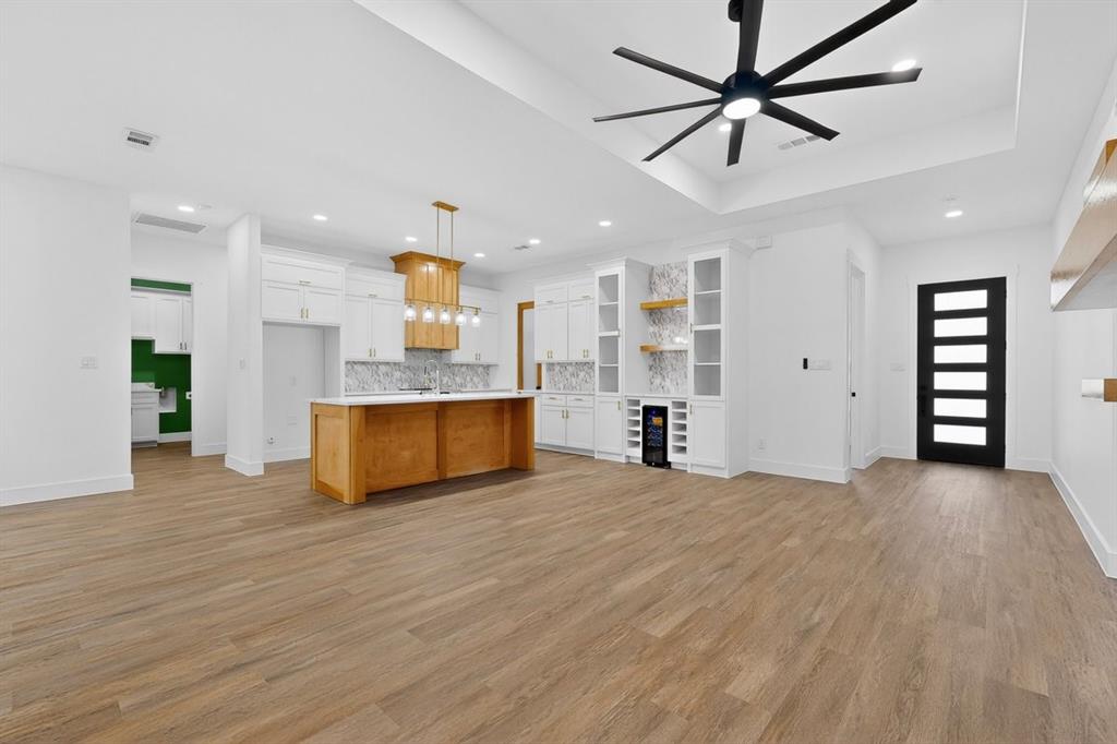 4737 Pine Ridge Court Athens, TX 75752 - Photo 4 of 26 a view of kitchen and empty room with wooden floor