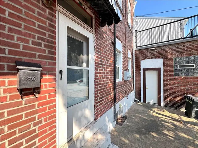 a view of a brick buildings with entryway doors