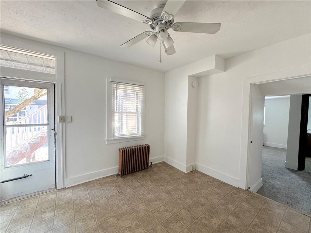 30 South 13th Street Pittsburgh, PA 15203 - Photo 5 of 13 a view of livingroom with furniture ceiling fan and window