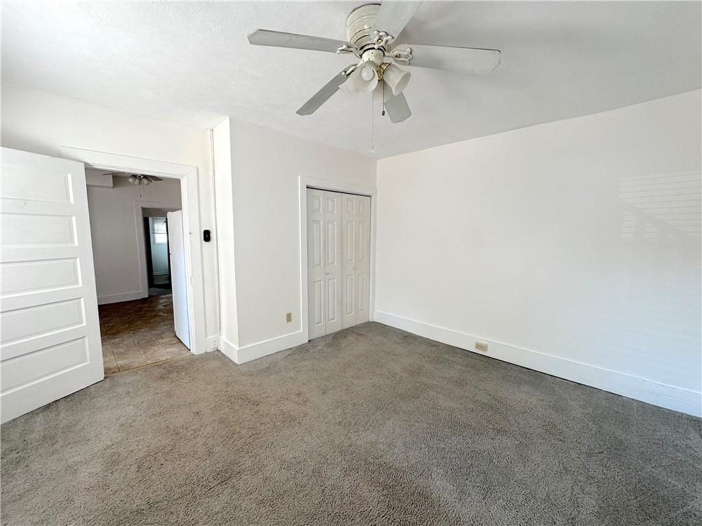30 South 13th Street Pittsburgh, PA 15203 - Photo 7 of 13 an empty room with closet and a ceiling fan