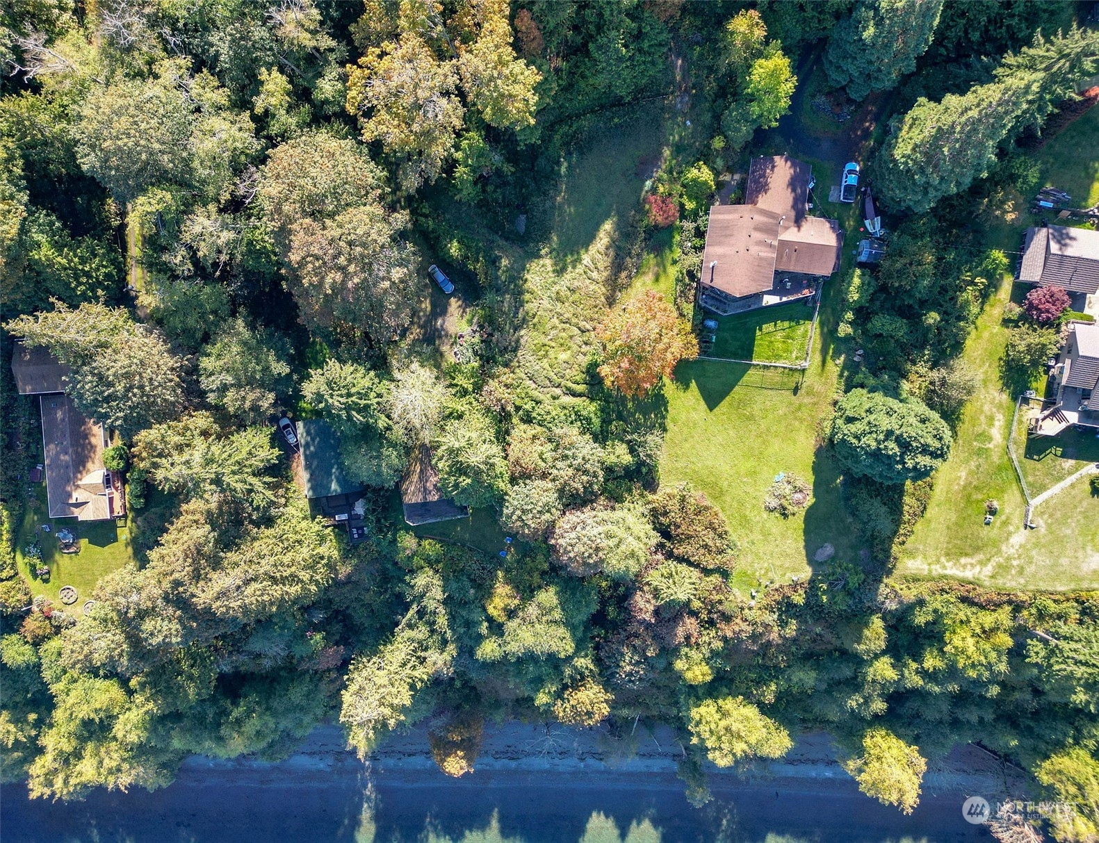 0 Northeast Twin Spits Road Hansville, WA 98340 - Photo 19 of 29 a backyard of a house with a lot of flowers