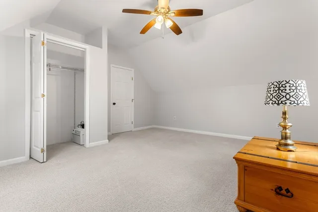 a view of empty room with ceiling fan