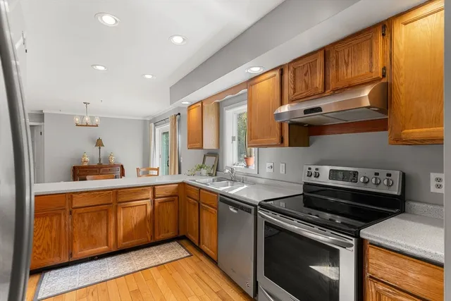 a kitchen with a sink stove and cabinets
