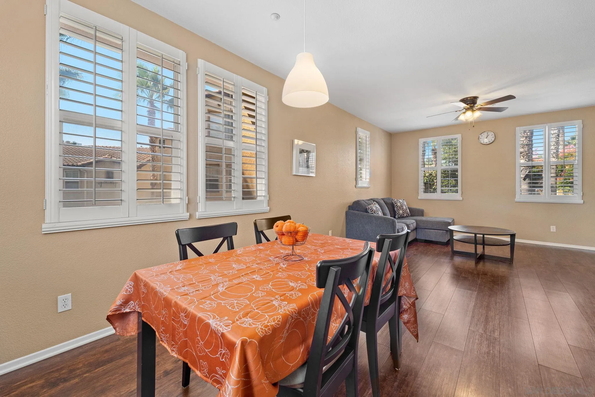 812 Compass Way San Diego, CA 92154 - Photo 13 of 39 a view of a dining room with furniture and wooden floor