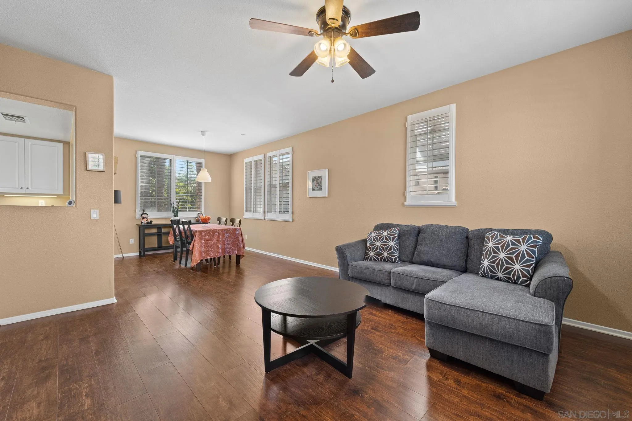 812 Compass Way San Diego, CA 92154 - Photo 17 of 39 a living room with furniture and a wooden floor