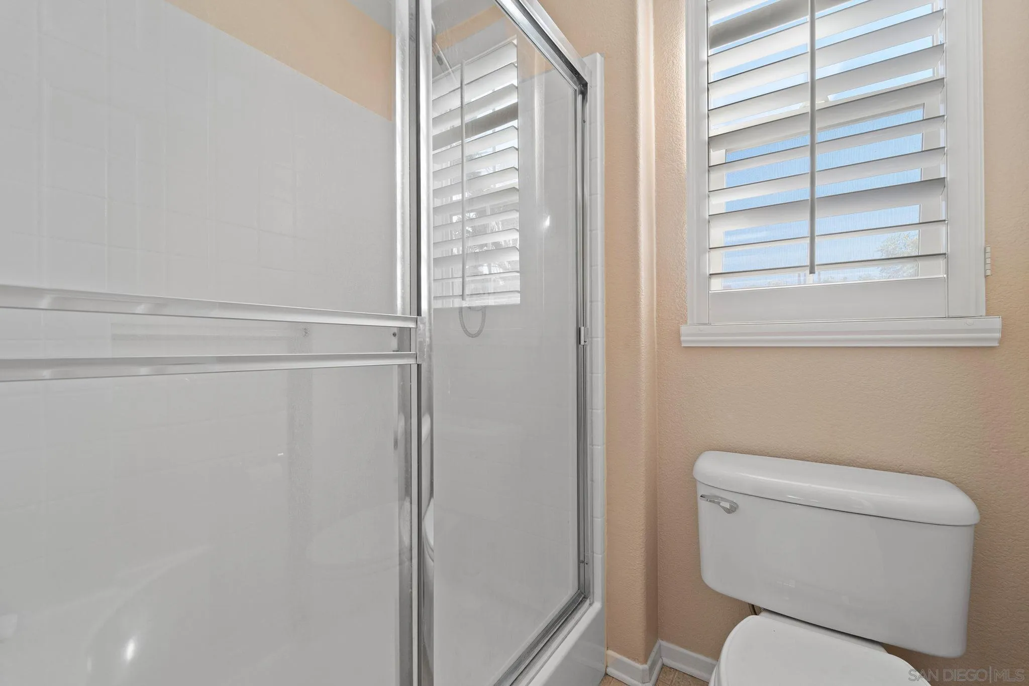 812 Compass Way San Diego, CA 92154 - Photo 22 of 39 a white toilet sitting next to a window