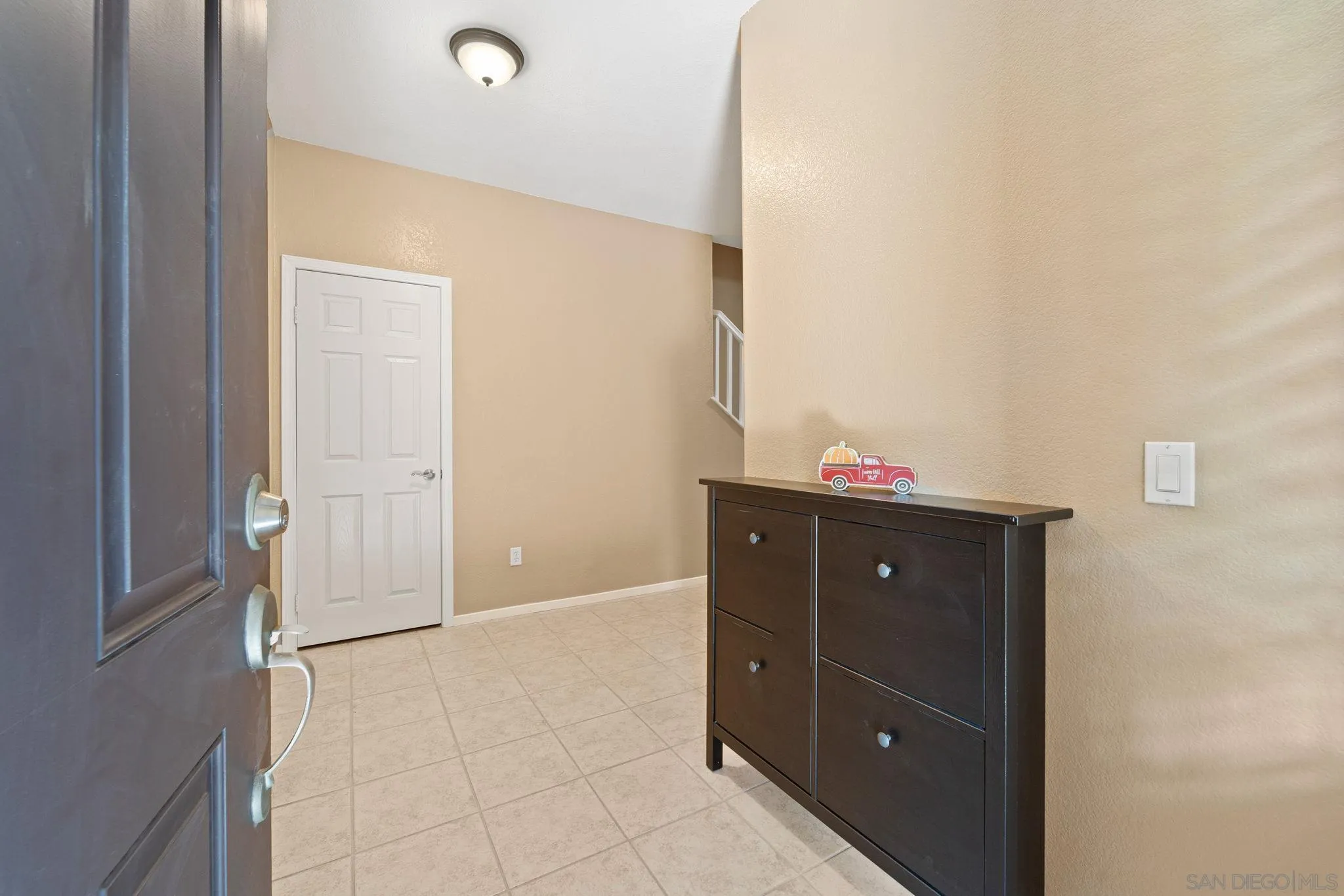 812 Compass Way San Diego, CA 92154 - Photo 28 of 39 a bathroom with a granite countertop sink and a mirror