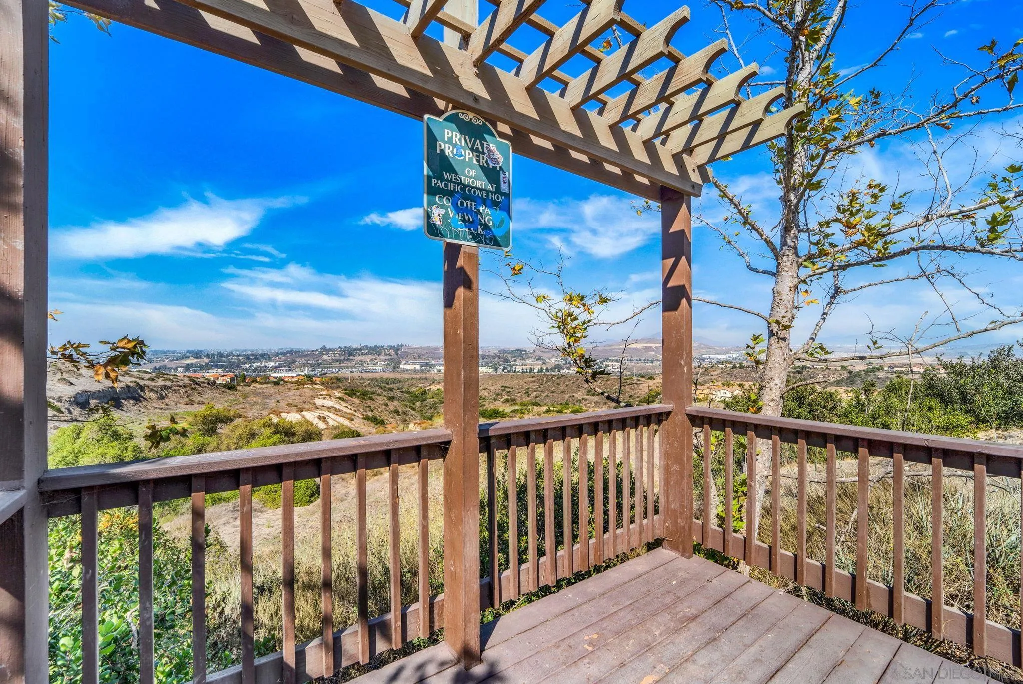 812 Compass Way San Diego, CA 92154 - Photo 32 of 39 a view of a balcony with wooden floor