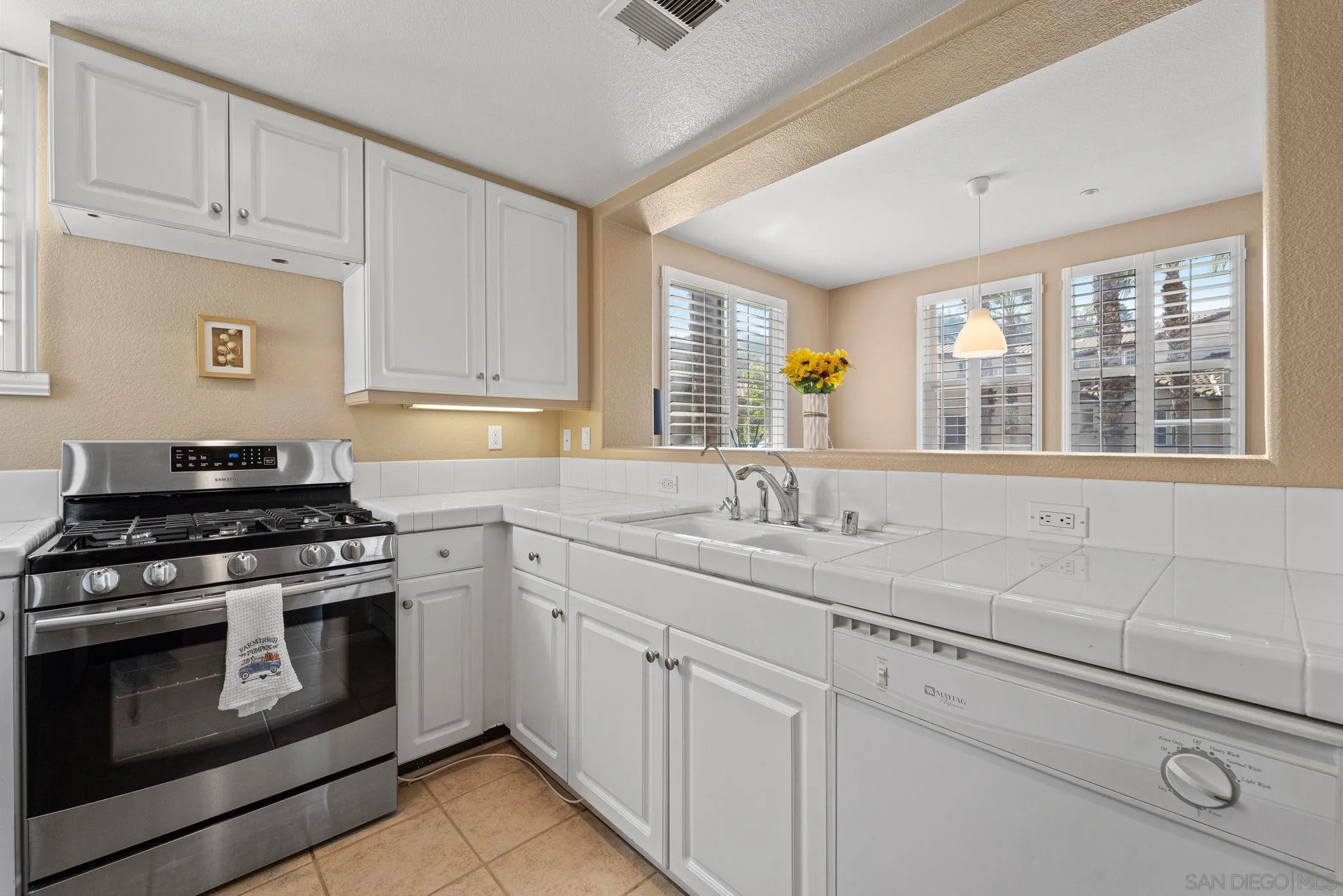 812 Compass Way San Diego, CA 92154 - Photo 6 of 39 a kitchen with appliances cabinets and a sink