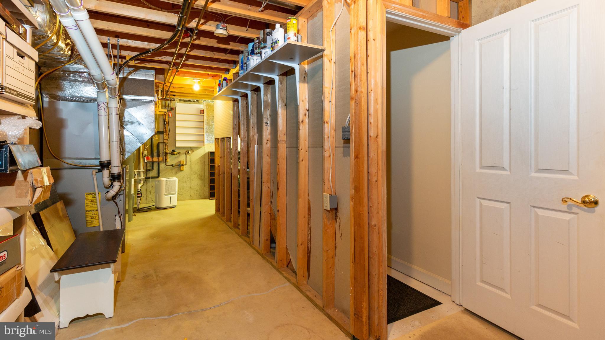 2395 Bear Den Road Frederick, MD 21701 - Photo 25 of 27 Unfinished basement with workshop area