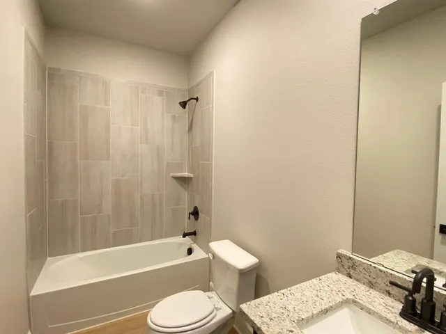 a bathroom with a sink toilet and a bathtub