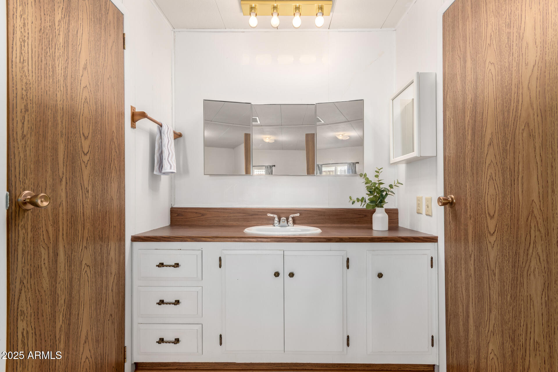 2700 East Allred Avenue, Unit R89 Mesa, AZ 85204 - Photo 14 of 28 a bathroom with a granite countertop sink and a mirror