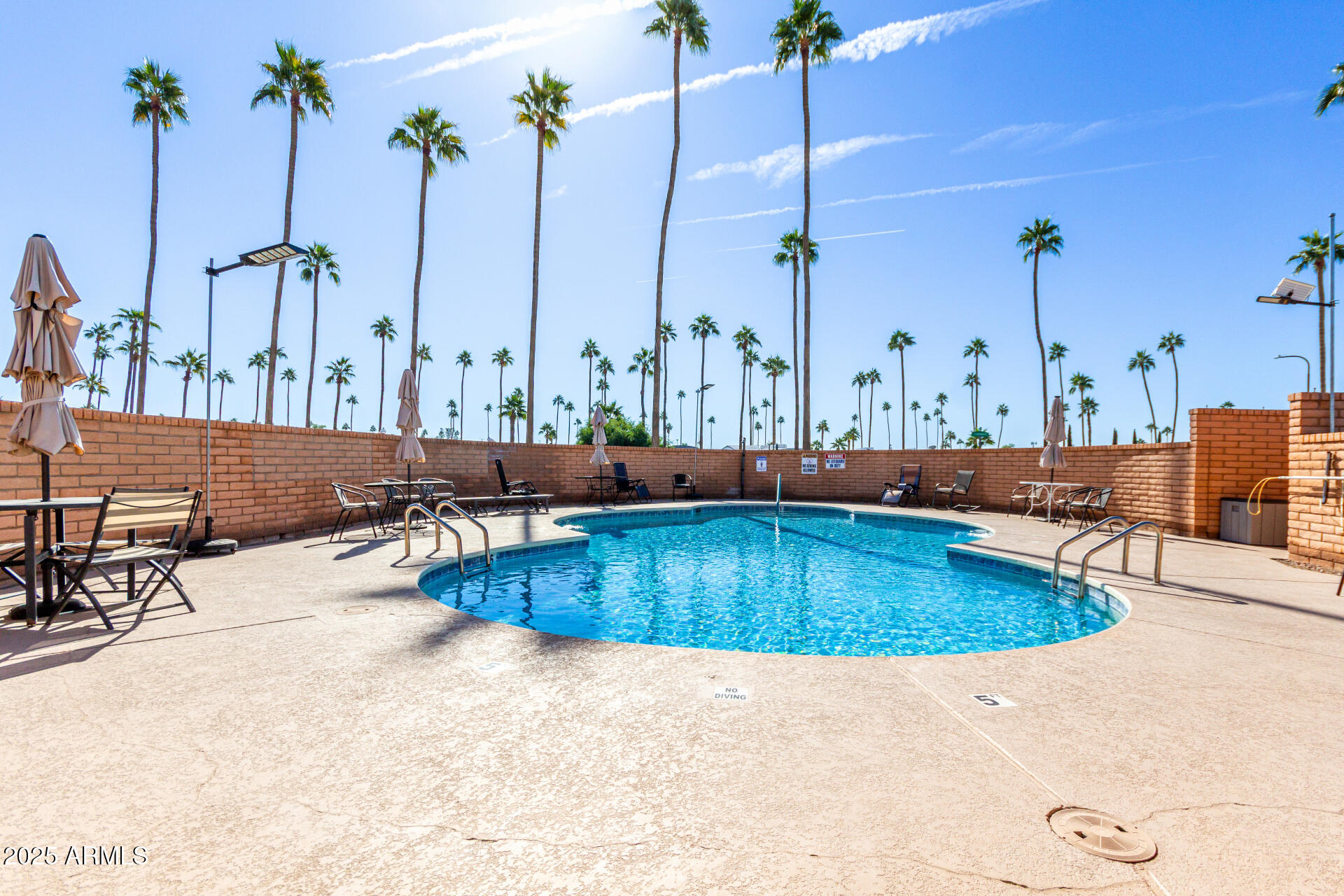 2700 East Allred Avenue, Unit R89 Mesa, AZ 85204 - Photo 22 of 28 a view of a swimming pool with a lake view