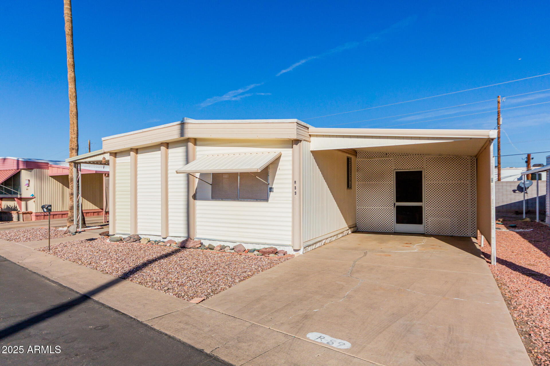 2700 East Allred Avenue, Unit R89 Mesa, AZ 85204 - Photo 4 of 28 a view of a house with a outdoor space