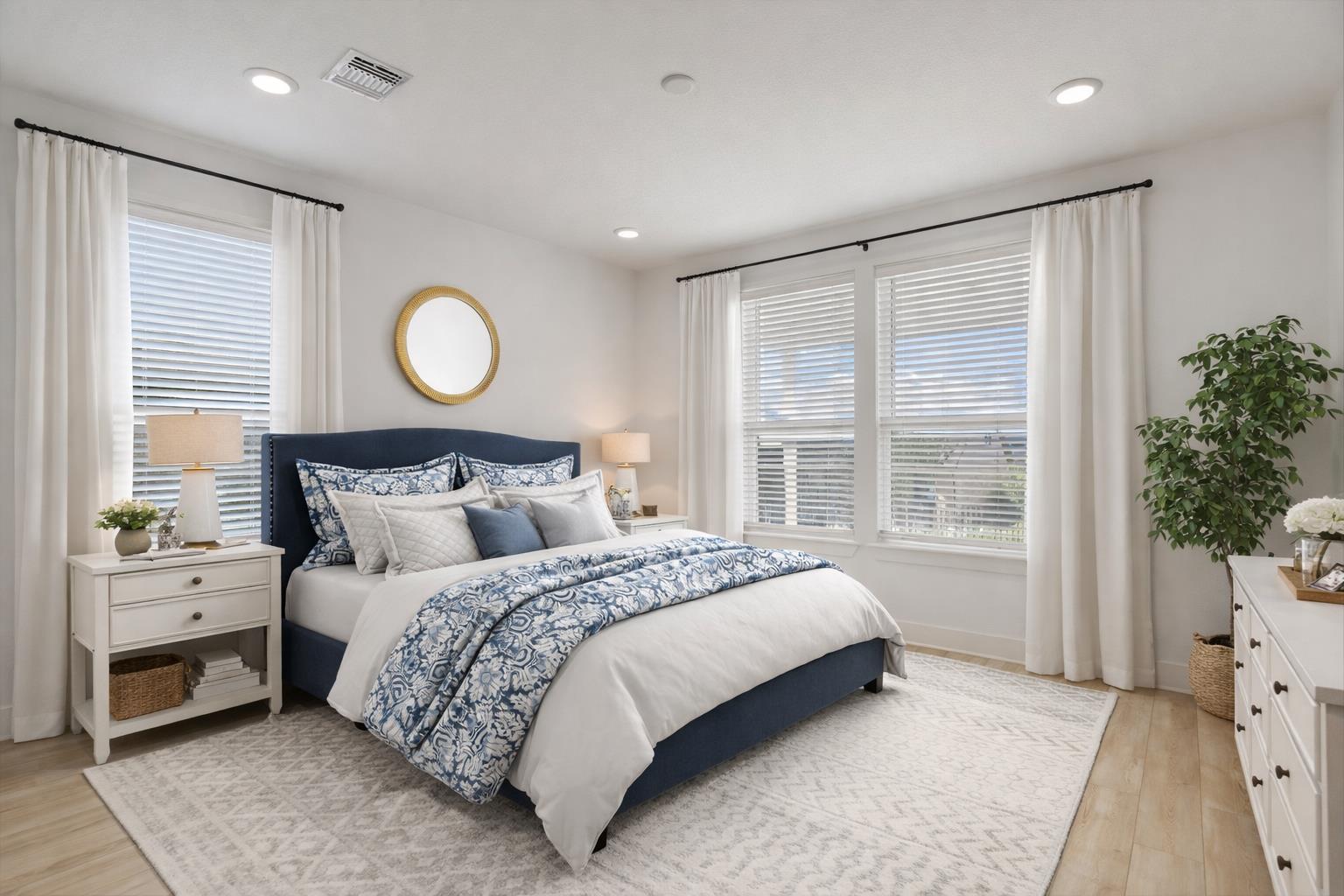 702 Kitty Hawk Road Georgetown, TX 78633 - Photo 10 of 20 a bedroom with a large bed and windows