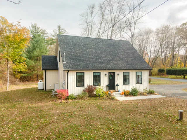 front view of a house with a yard