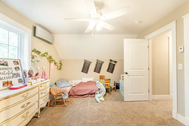 a bedroom with a bed and a cabinets