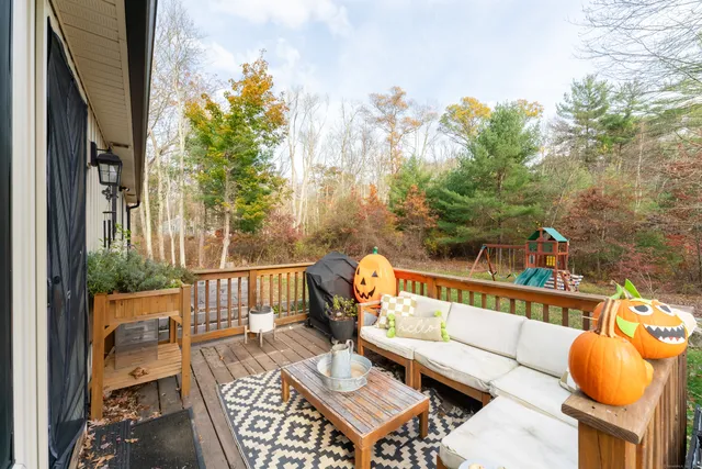 a view of a chairs and table on the balcony
