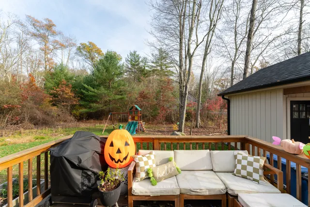 a house view with a sitting space and garden
