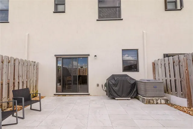 a living room with furniture and a chair