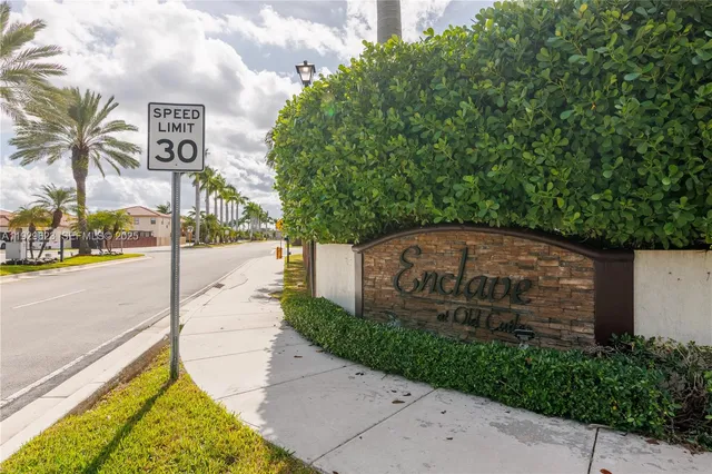a view of a street with a sign board