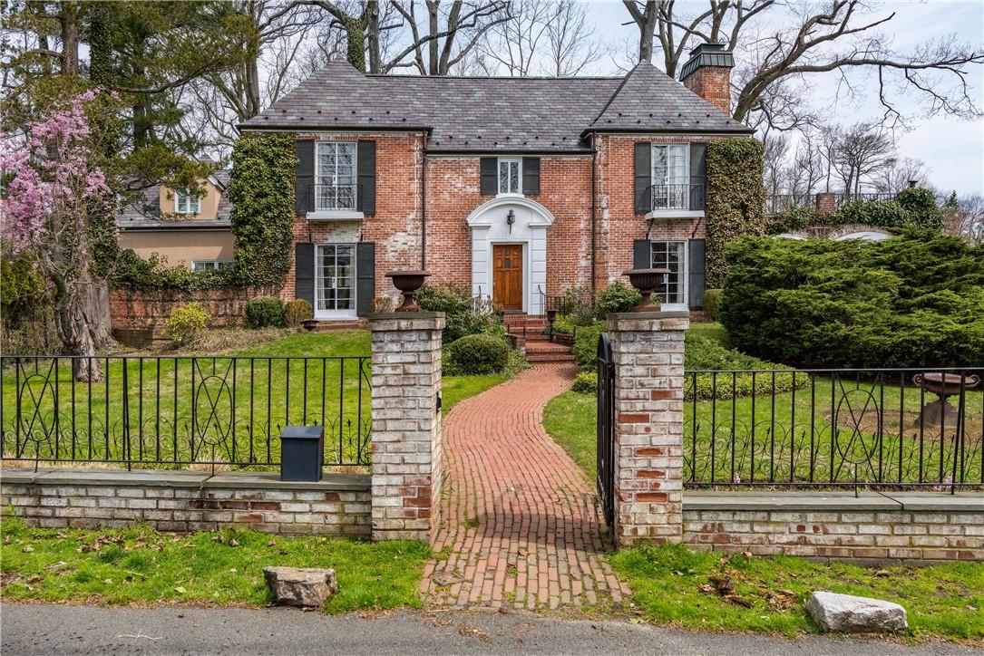 93 Greenhaven Road Rye, NY 10580 - Photo 1 of 1 a front view of a house with a garden and plants