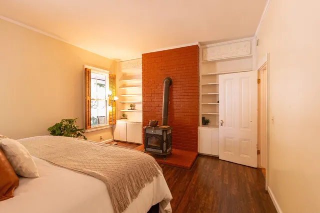 a bathroom with a sink a toilet and shower curtain