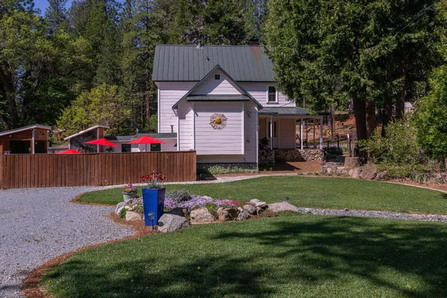 a front view of a house with garden