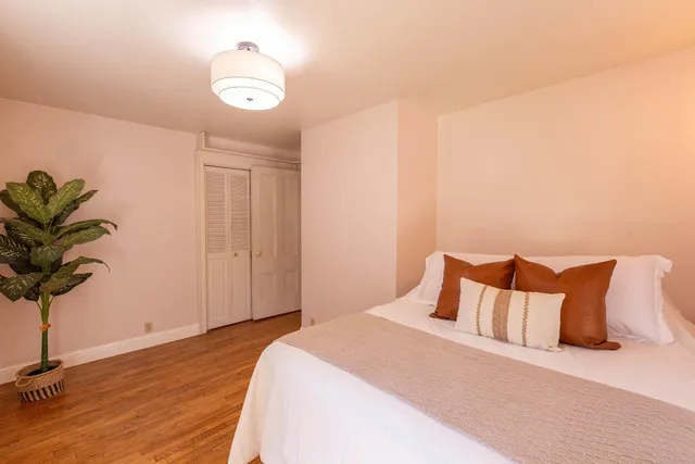 a view of a yard with a house in the background