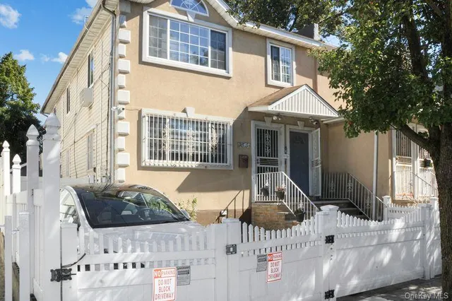 a view of house with a chairs and table in a patio