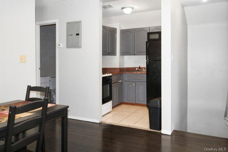219-19 143rd Road Queens, NY 11413 - Photo 6 of 10 a view of a kitchen from the hallway