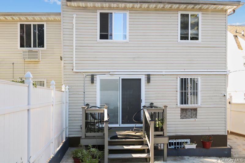 219-19 143rd Road Queens, NY 11413 - Photo 8 of 10 a view of a brick house with many windows