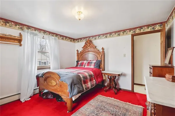 a bed room with a bed and a window