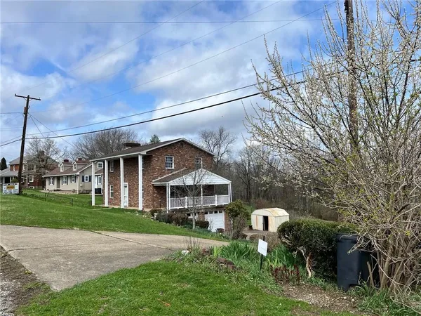 a view of roof deck with wooden fence