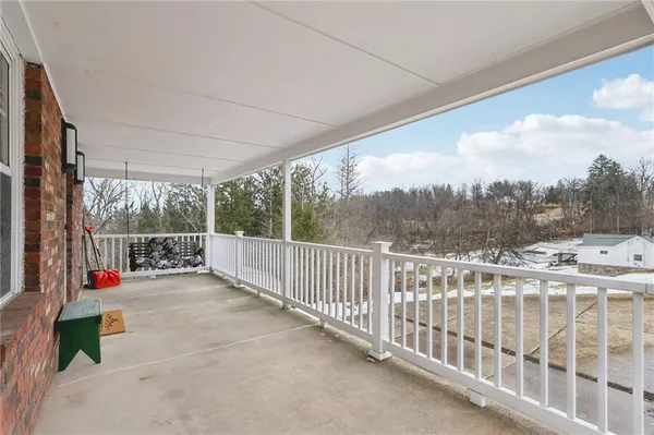 a view of roof deck with wooden fence