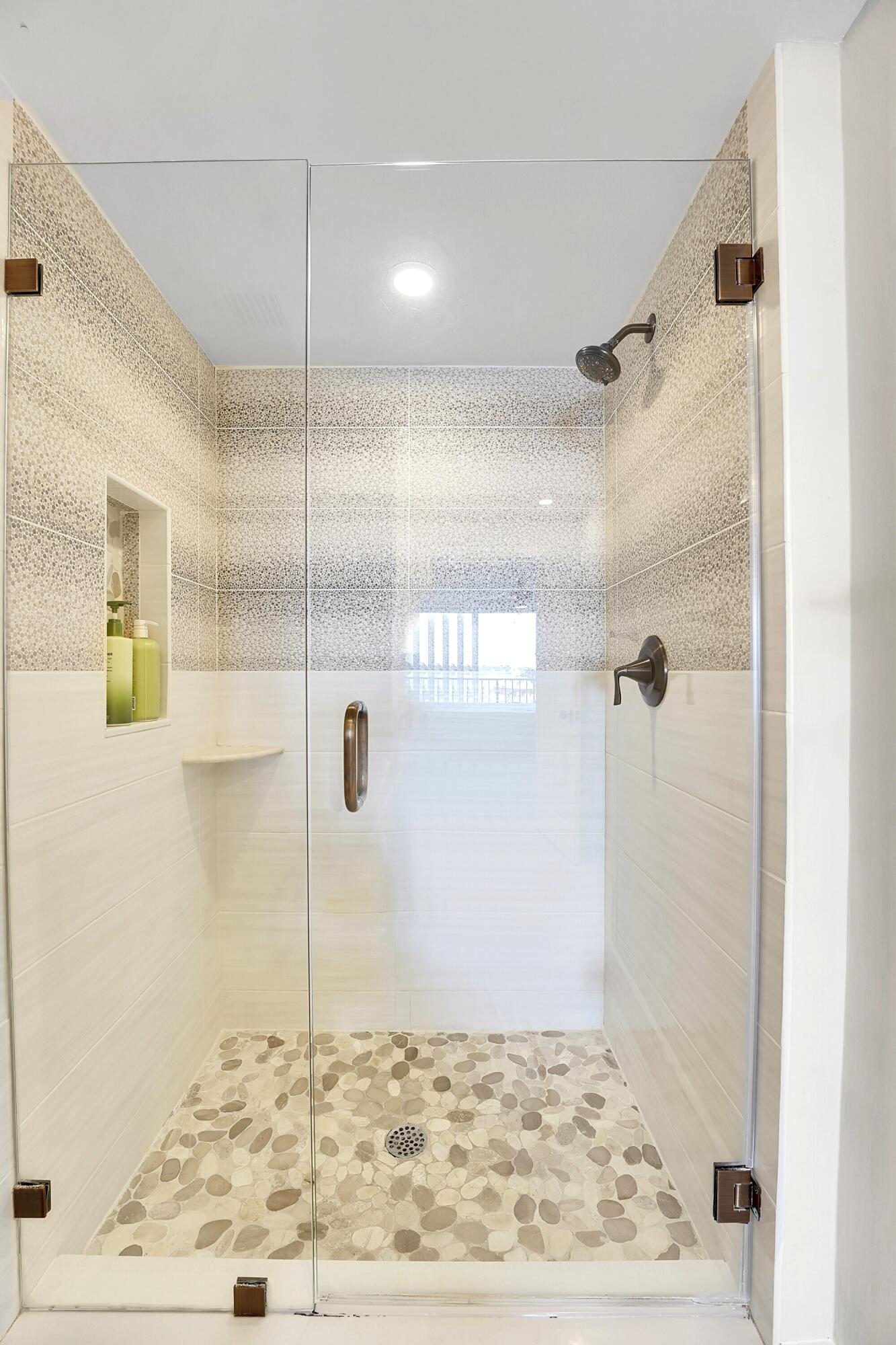 134 Lakeshore Drive, Unit 316 North Palm Beach, FL 33408 - Photo 13 of 30 a bathroom with a shower
