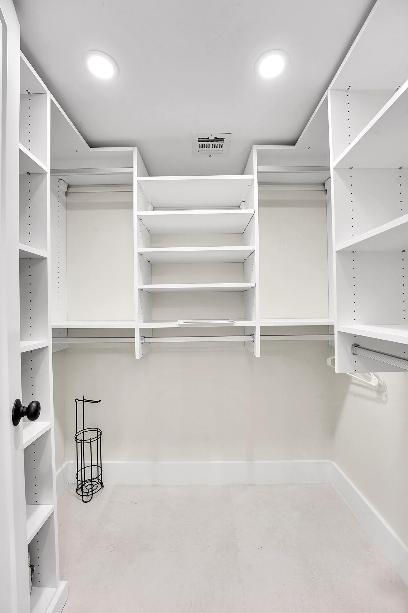 134 Lakeshore Drive, Unit 316 North Palm Beach, FL 33408 - Photo 14 of 30 a view of walk in closet with empty racks