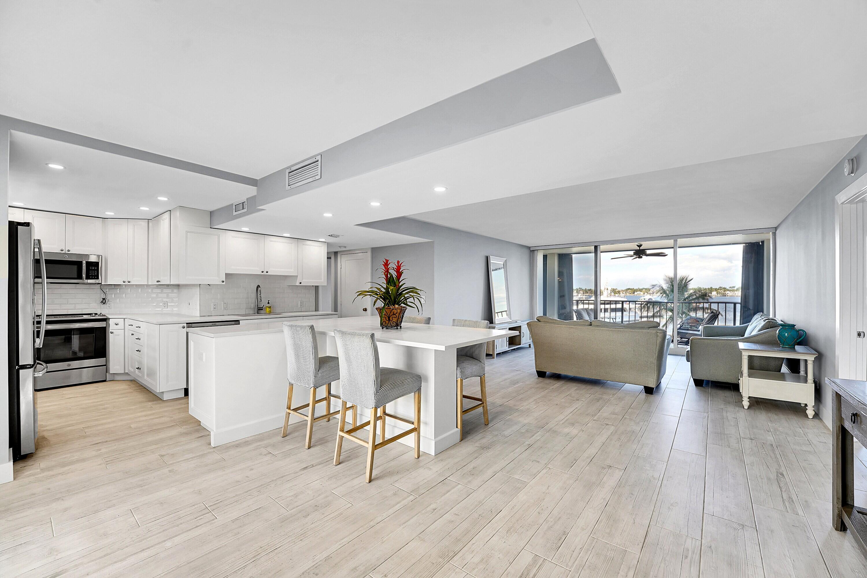 134 Lakeshore Drive, Unit 316 North Palm Beach, FL 33408 - Photo 6 of 30 a living room with furniture and a wooden floor