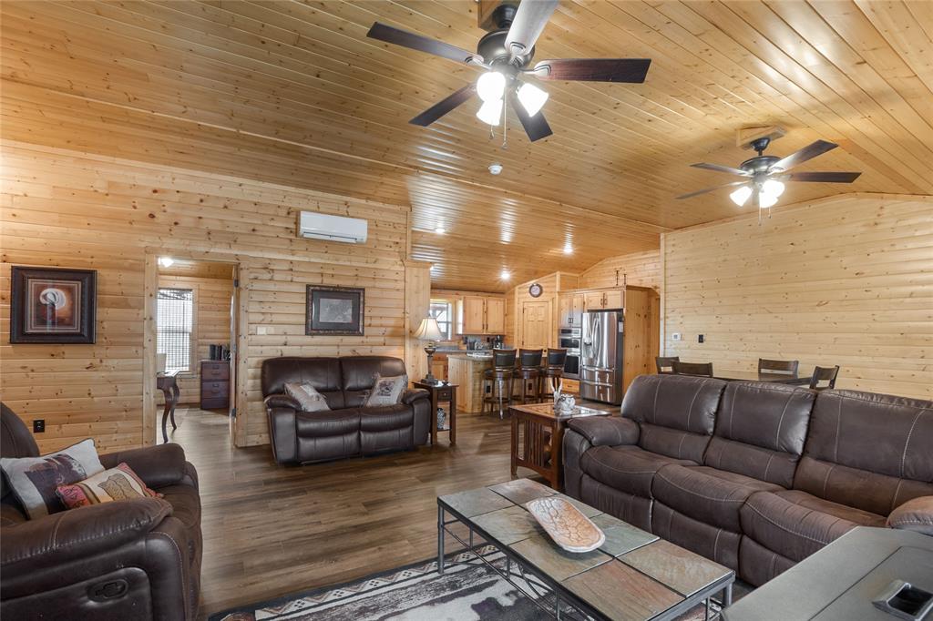 2290 Brooks Lane Sadler, TX 76264 - Photo 18 of 38 a living room with furniture ceiling fan and a rug