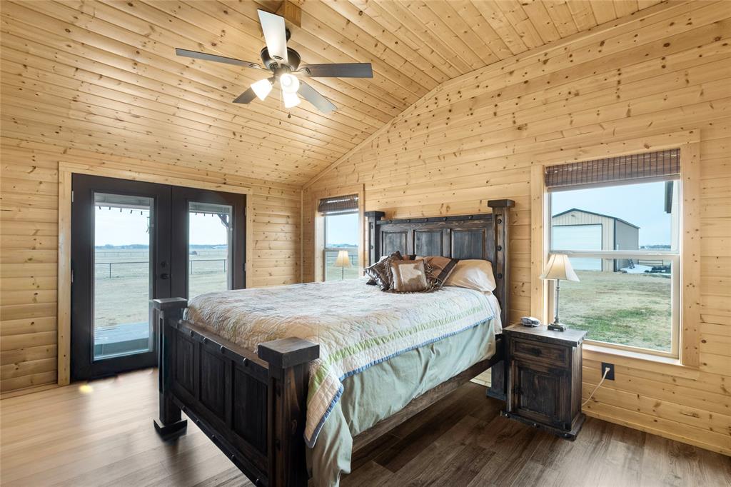 2290 Brooks Lane Sadler, TX 76264 - Photo 25 of 38 a bedroom with a large bed and a large window
