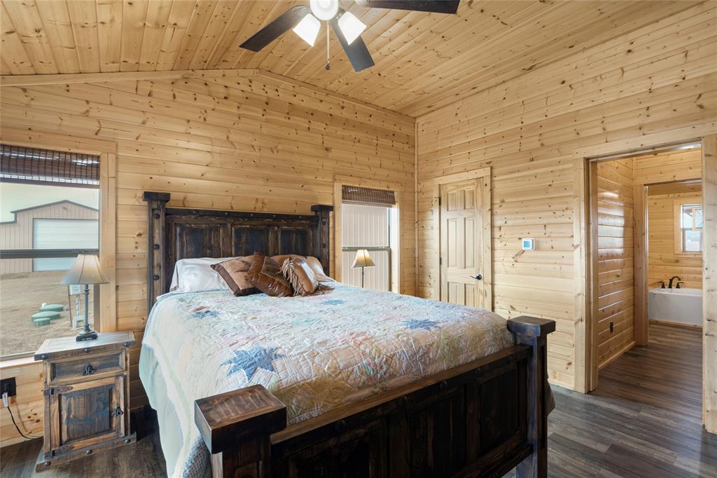 2290 Brooks Lane Sadler, TX 76264 - Photo 26 of 38 a bedroom with a bed and wooden floor