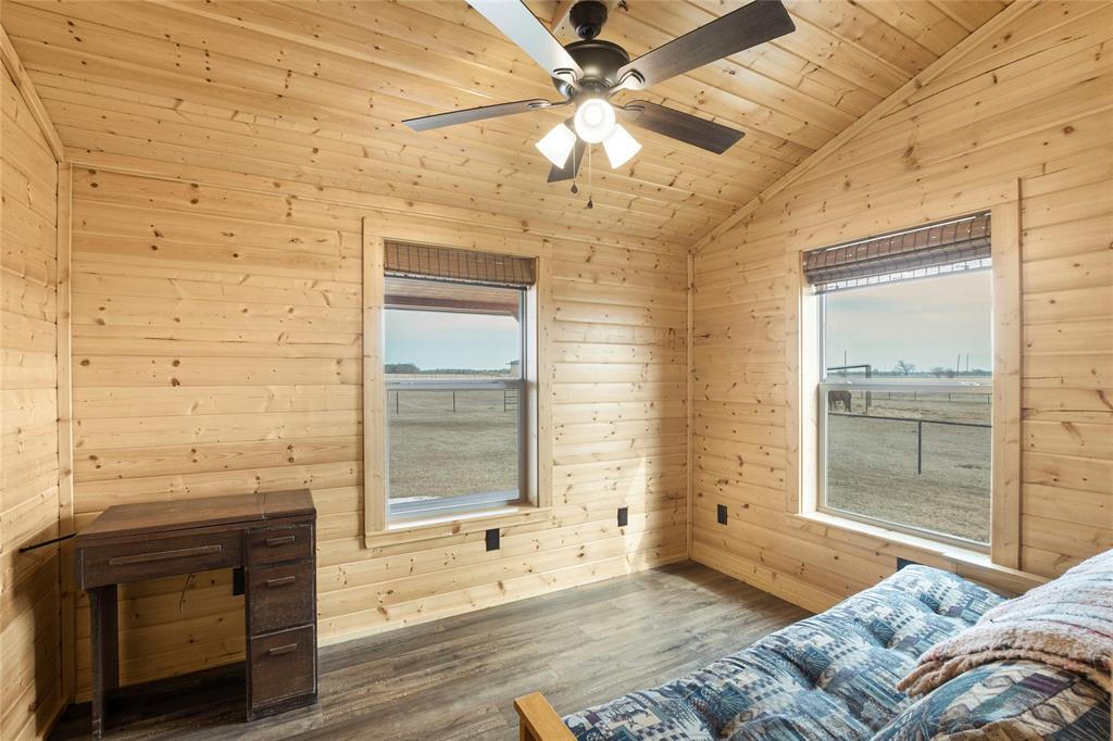 2290 Brooks Lane Sadler, TX 76264 - Photo 32 of 38 a bedroom with a bed and a chandelier fan