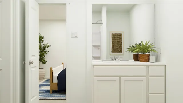 a bathroom with a toilet and a shower curtain